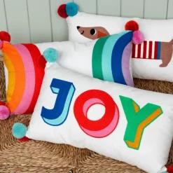 Rex London Embroidered cushion with pom poms - Sausage Dog Fashion